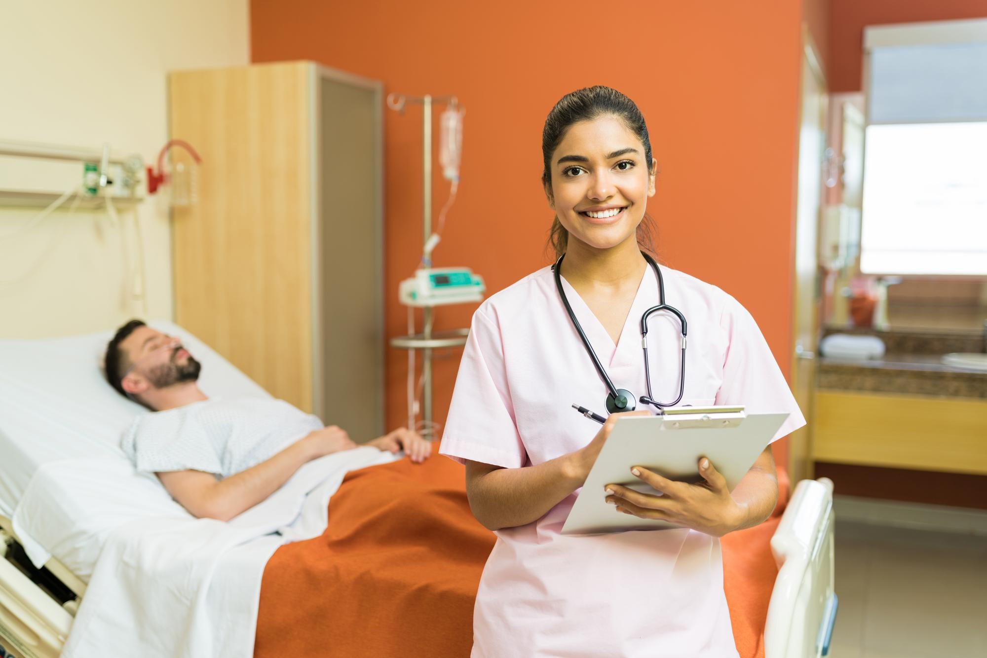 confident-female-doctor-with-reports-clipboard-standing-against-male-patient-hospital